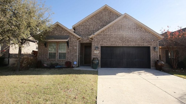 view of front of house with a garage and a front yard