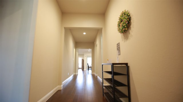 hallway with dark hardwood / wood-style floors