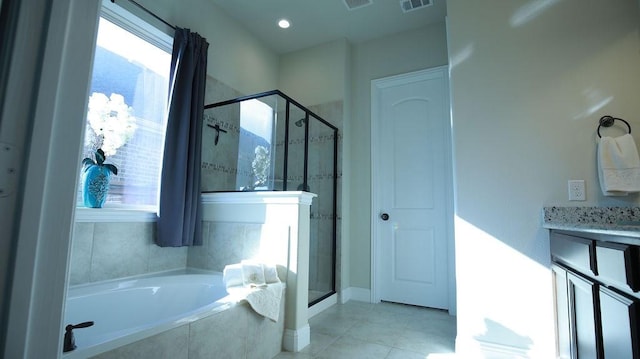 bathroom featuring vanity and shower with separate bathtub