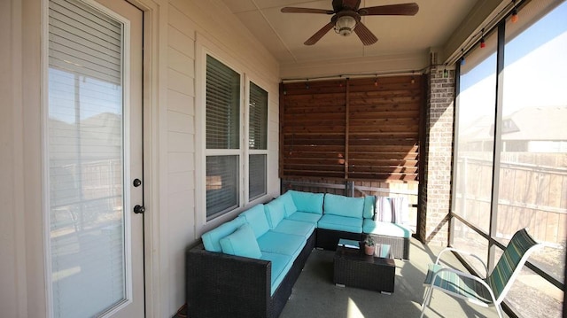 sunroom / solarium with ceiling fan and a healthy amount of sunlight