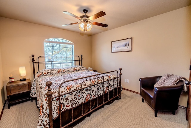 bedroom featuring light colored carpet and ceiling fan