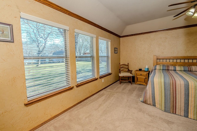 bedroom featuring light carpet, ornamental molding, multiple windows, and lofted ceiling