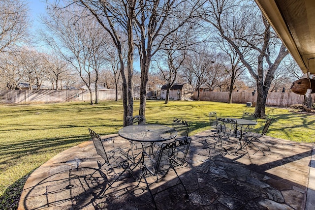 view of patio / terrace with a shed