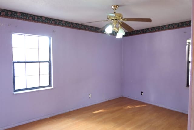 unfurnished room featuring ceiling fan and light hardwood / wood-style floors