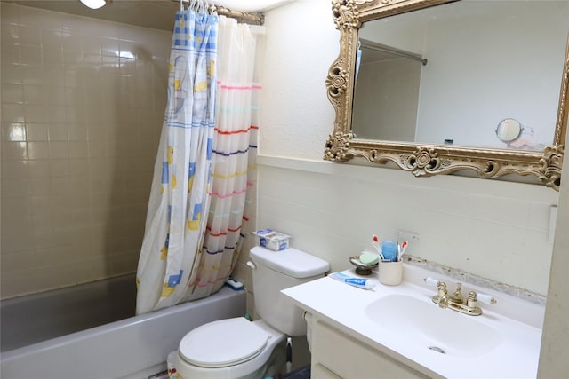 full bathroom with vanity, shower / bath combo, and toilet