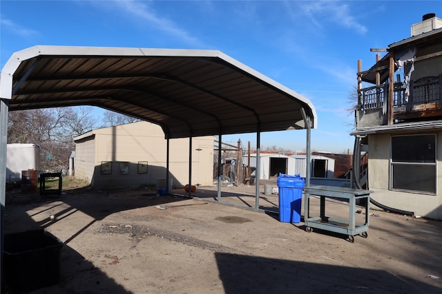 view of vehicle parking with a carport