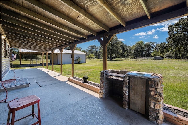 view of patio with an outbuilding