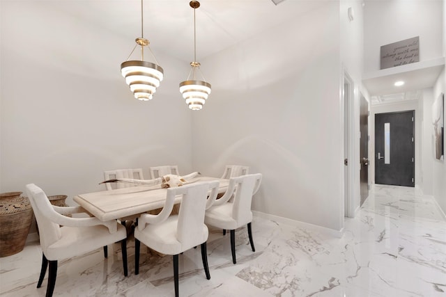 dining space featuring an inviting chandelier