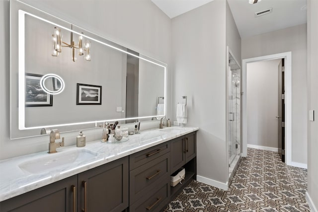 bathroom featuring vanity and a shower with shower door