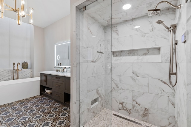 bathroom featuring vanity, separate shower and tub, and an inviting chandelier