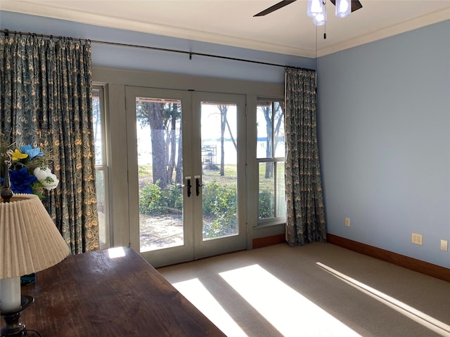 doorway to outside featuring french doors, ceiling fan, ornamental molding, and carpet floors