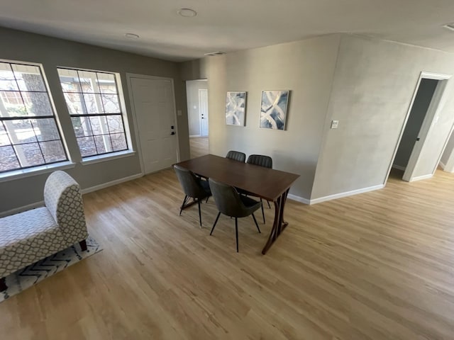 dining area with light wood-type flooring