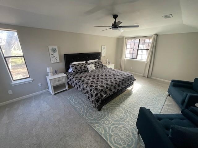 carpeted bedroom with ceiling fan