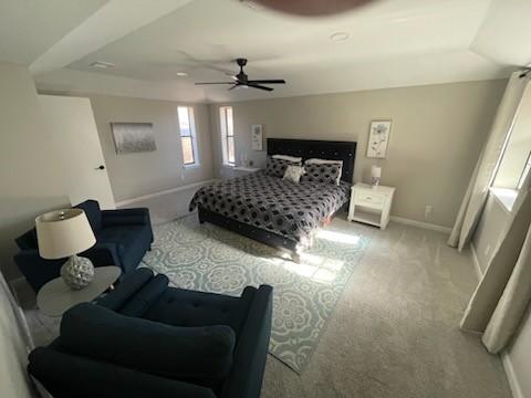 carpeted bedroom with ceiling fan