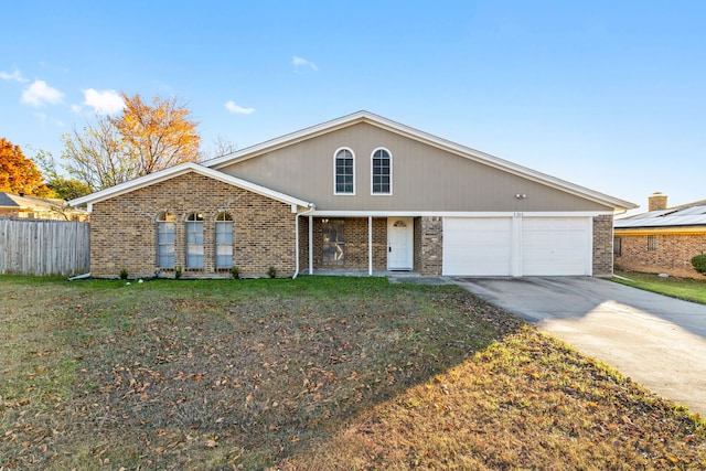 view of front of property with a garage and a front yard