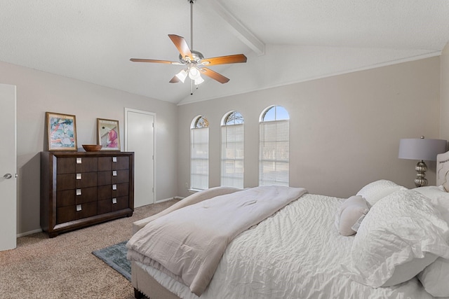 bedroom featuring light carpet, vaulted ceiling with beams, and ceiling fan