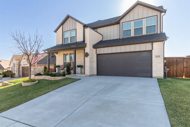 view of front facade featuring a front yard and a garage