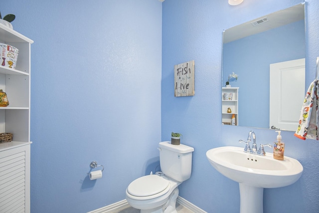 bathroom with sink and toilet