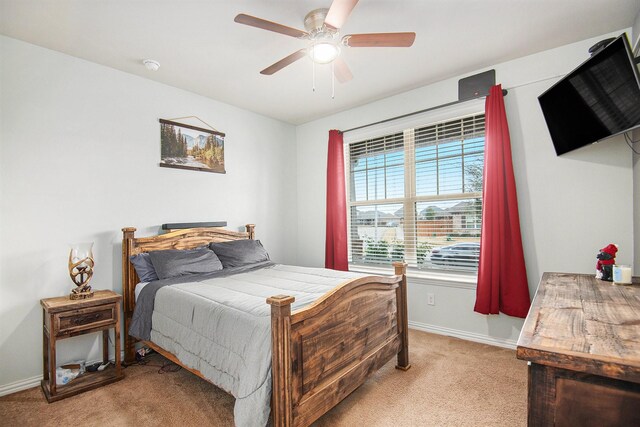 bedroom featuring ceiling fan and light colored carpet