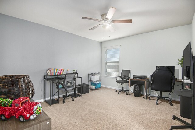 office space with light colored carpet and ceiling fan