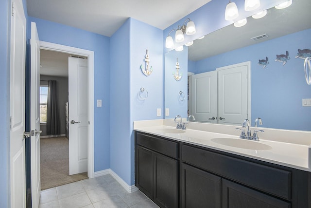 bathroom with vanity and tile patterned floors