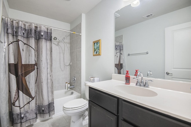 full bathroom with tile patterned flooring, shower / bath combo, vanity, and toilet