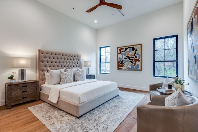 bedroom featuring hardwood / wood-style floors and ceiling fan