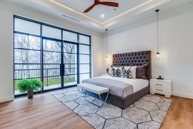 bedroom featuring ceiling fan and hardwood / wood-style floors