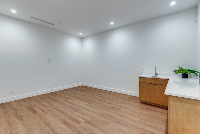 spare room with light hardwood / wood-style floors