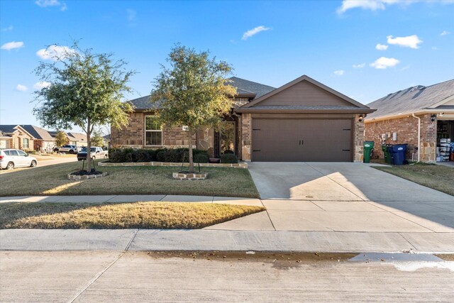 view of front of house with a front lawn and a garage