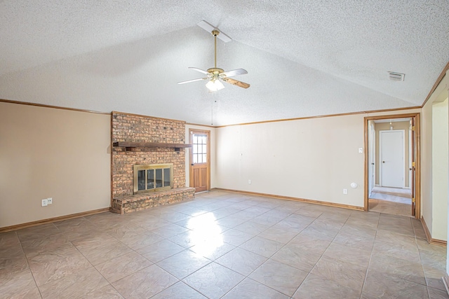 unfurnished living room featuring a textured ceiling, ceiling fan, a fireplace, and vaulted ceiling