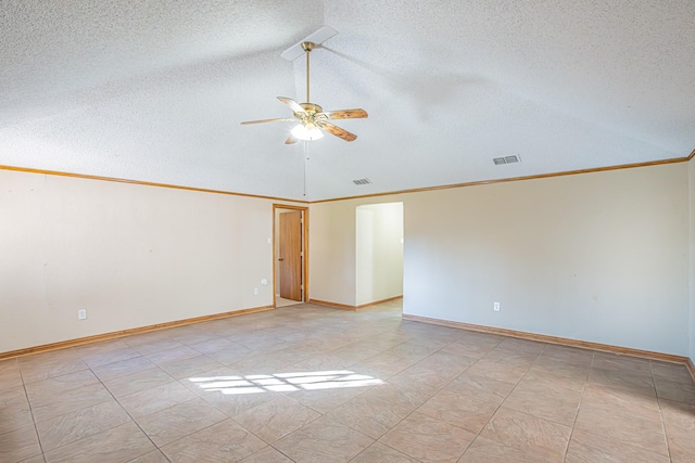 empty room with a textured ceiling, vaulted ceiling, ceiling fan, and ornamental molding