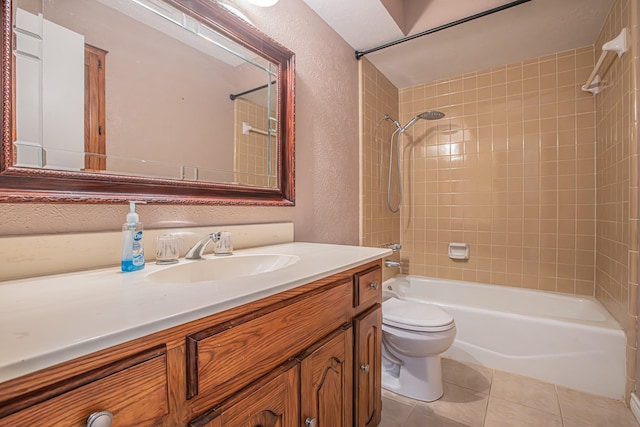 full bathroom with tile patterned flooring, vanity, toilet, and tiled shower / bath