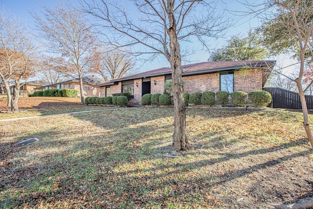 ranch-style house with a front lawn