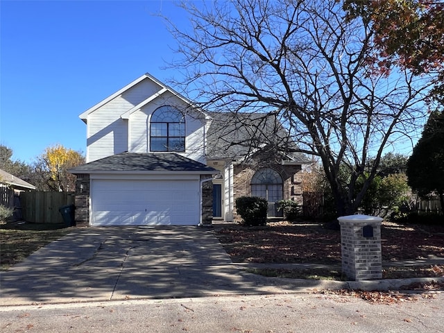 view of front property with cooling unit and a garage