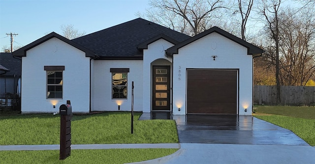 view of front of house with a front lawn and a garage