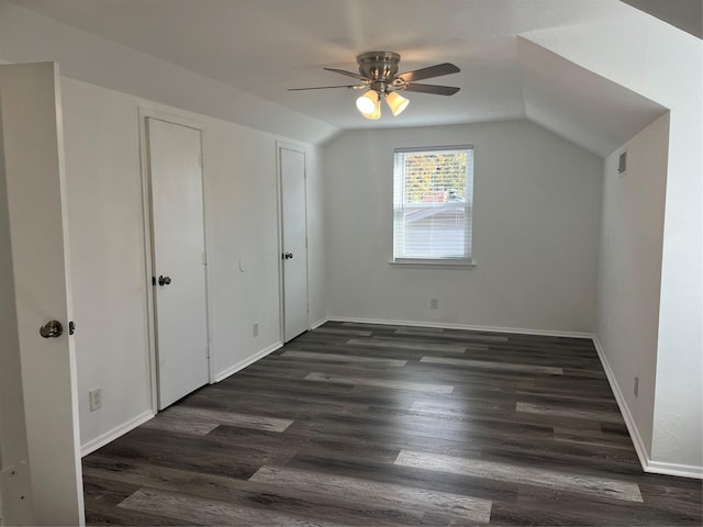 bonus room featuring dark hardwood / wood-style flooring, vaulted ceiling, and ceiling fan