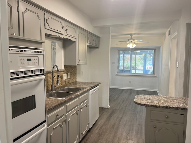 kitchen with gray cabinets, ceiling fan, sink, and white appliances