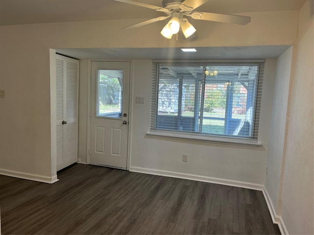 entryway with dark hardwood / wood-style floors and ceiling fan