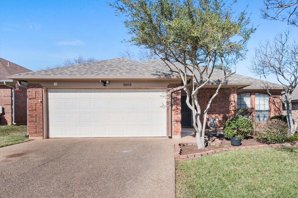 single story home featuring a garage