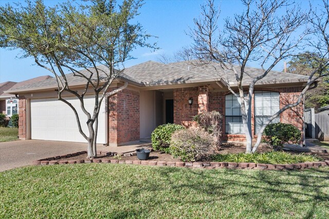 single story home featuring a garage and a front yard