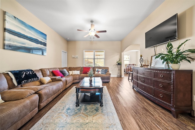 living room featuring ceiling fan and wood-type flooring