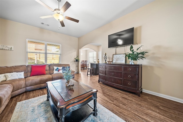 living room featuring hardwood / wood-style flooring and ceiling fan