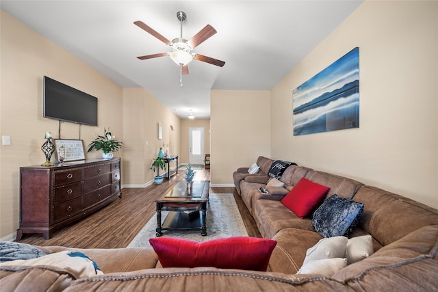 living room with ceiling fan and light wood-type flooring