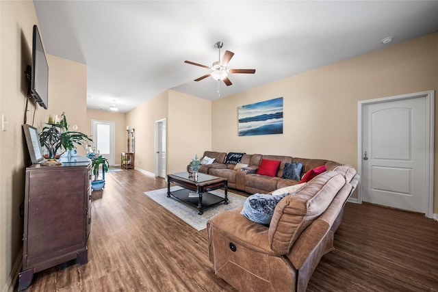 living room with dark hardwood / wood-style floors and ceiling fan