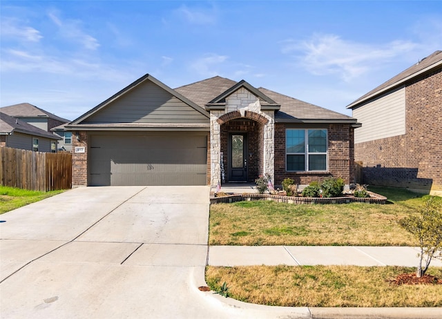 view of front of house with a garage and a front yard