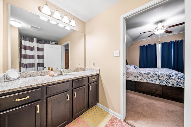 bathroom featuring ceiling fan and vanity