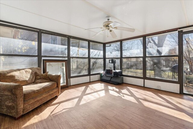 sunroom / solarium featuring ceiling fan