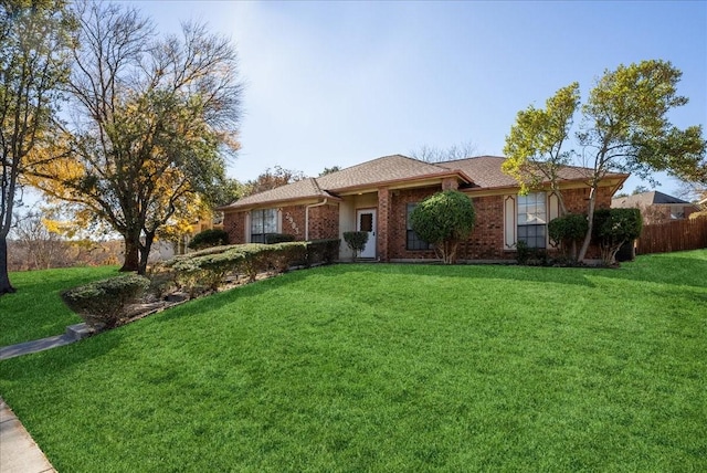 ranch-style home featuring a front yard