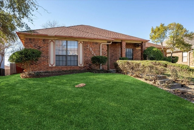 ranch-style home featuring a front yard